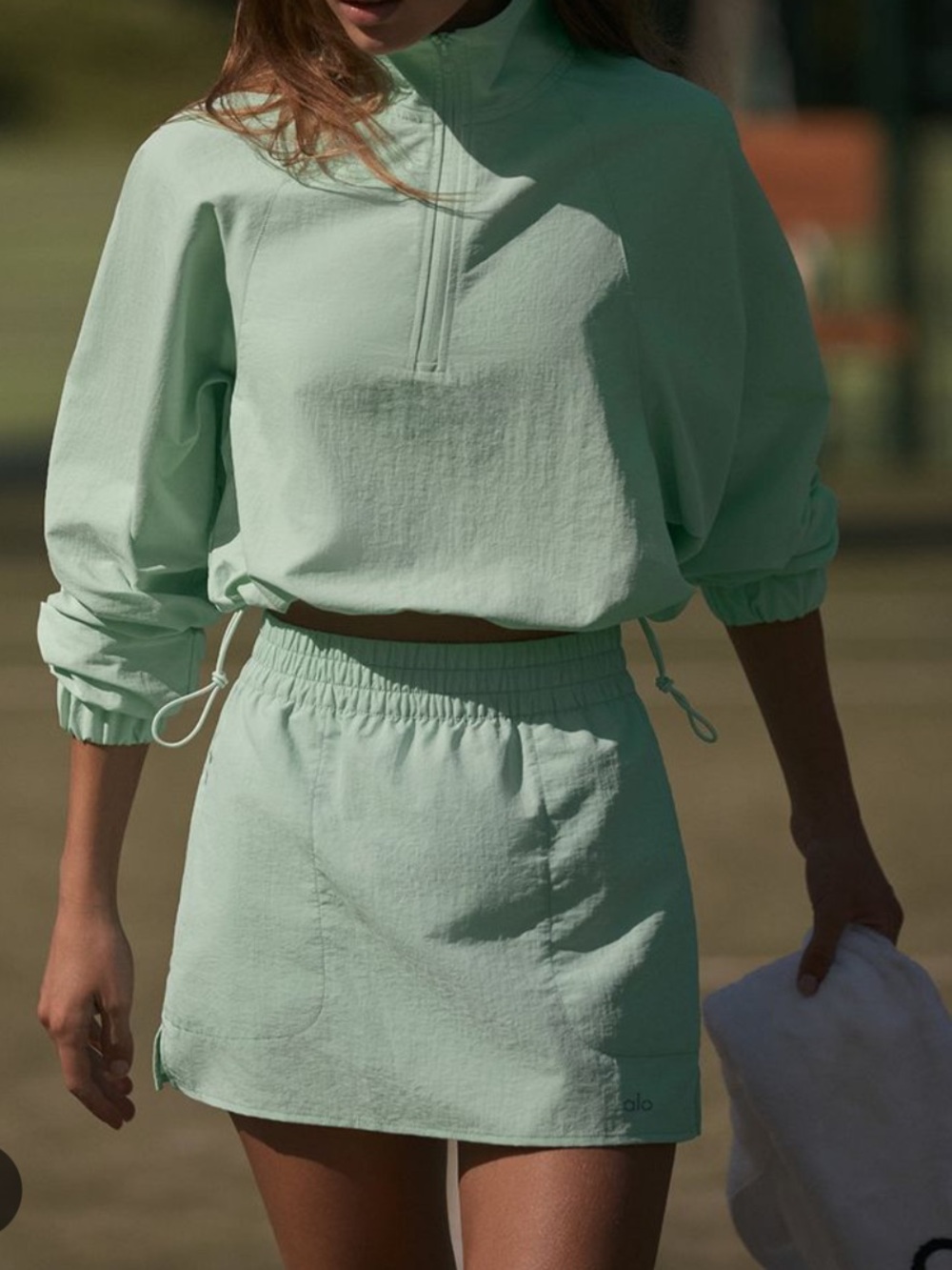 Alo alumni skort in spearmint green